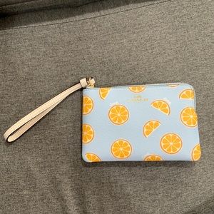 Coach blue with oranges wristlet